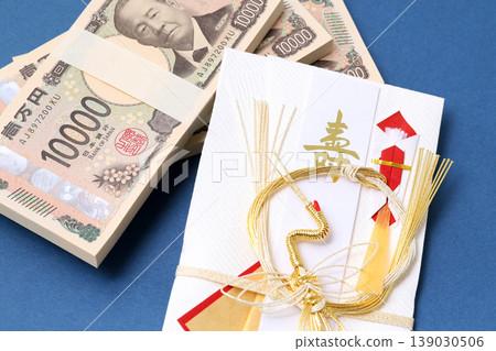A gift envelope and a wad of cash A gift envelope and a wad of cash 139030506