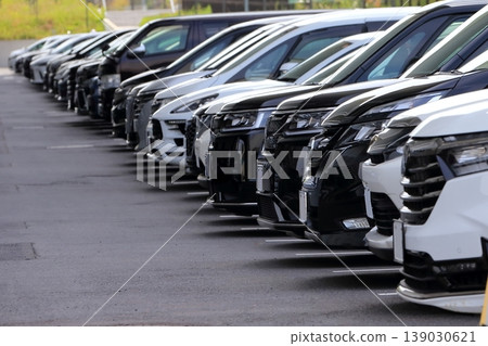 Passenger cars lining up in the parking lot Passenger cars lining up in the parking lot 139030621