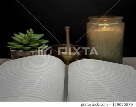 Open Book with Singing Bowl Candle and Succulent Plant for Meditation Spiritual Reflection Mindfulness Practice Wellness Concept Calm Healing Environment Holistic Self Care and Inner Peace Scene Open Book with Singing Bowl Candle and Succulent Plant for Meditation Spiritual Reflection Mindfulness Practice Wellness Concept Calm Healing Environment Holistic Self Care and Inner Peace Scene 139030879