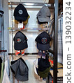 Yogyakarta, Indonesia - March 18th 2026: Collection of stylish baseball caps and bucket hats displayed neatly on metal racks in a modern retail clothing store. Perfect for fashion, 139032234