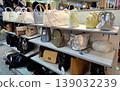 Yogyakarta, Indonesia - March 18th 2026: Multiple shelves stocked with a wide variety of stylish handbags and purses in a retail store setting 139032239