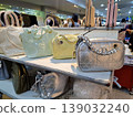 Yogyakarta, Indonesia - March 18th 2026: Vibrant display of fashionable handbags in various colors like silver, yellow, and green, neatly arranged on store shelves 139032240