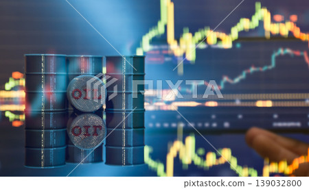 Oil trading concept: miniature oil barrels against a blurred financial stock market chart. Energy crisis and global economy. Oil trading concept: miniature oil barrels against a blurred financial stock market chart. Energy crisis and global economy. 139032800