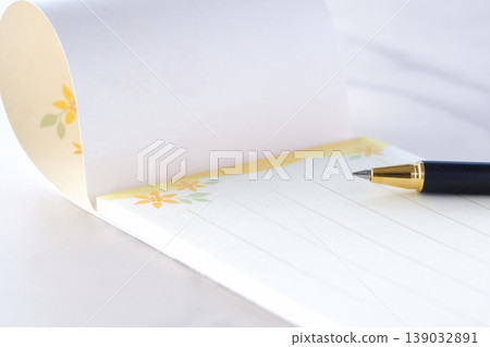 Letter - The image of writing a letter on a notepad. Letter - The image of writing a letter on a notepad. 139032891