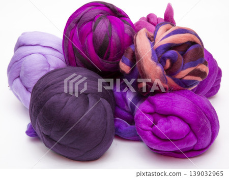 Multicolored skeins of merino wool on a white background 139032965