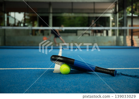 Padel activity is taking place on a sunny court in Bali Padel activity is taking place on a sunny court in Bali 139033029