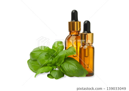 Basil leaves with two dropper bottles nearby for aroma, PNG 139033049