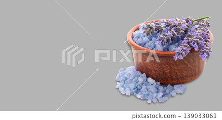 Bowl with blue bath salts and lavender flowers placed next to it Bowl with blue bath salts and lavender flowers placed next to it 139033061