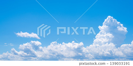 A summer scene of cumulonimbus clouds and a blue sky. A summer scene of cumulonimbus clouds and a blue sky. 139033191