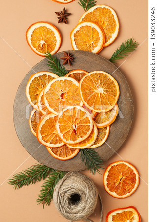 Dried orange slices are nicely placed on a round plate 139033246