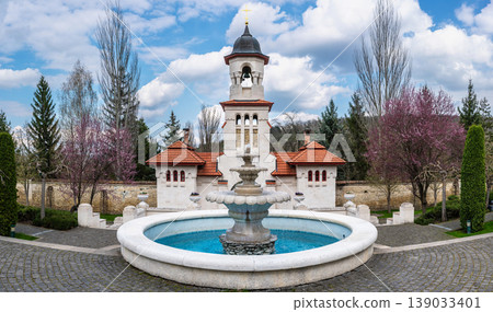 White Bell Tower and Stone Fountain at Curchi Monastery Grounds White Bell Tower and Stone Fountain at Curchi Monastery Grounds 139033401