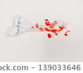 A shattered flask and spilled liquid create a dramatic visual, possibly representing a science experiment gone wrong 139033646