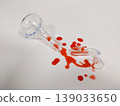 A shattered flask and spilled liquid suggest a science experiment gone wrong or a lab accident 139033650