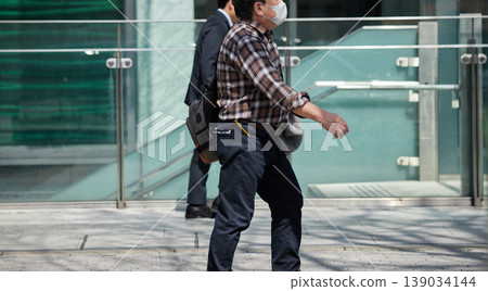 The sight of office workers walking in Nagoya's downtown area during the daytime. The sight of office workers walking in Nagoya's downtown area during the daytime. 139034144