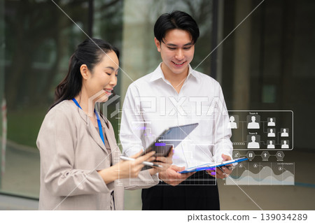 Businessman hand Project manager working and update tasks and Gantt chart scheduling virtual diagram.with smart phone, tablet and laptop. 139034289