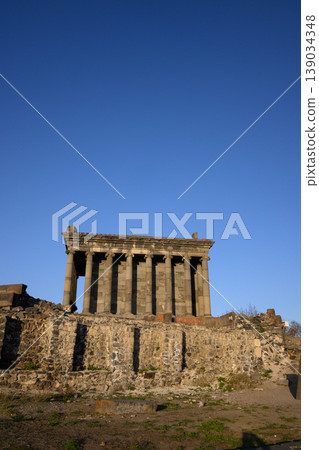 Sunlit Garni temple ruins on rocky terrain with no vegetation Sunlit Garni temple ruins on rocky terrain with no vegetation 139034348