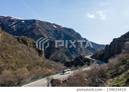 Mountain highway curves between steep cliffs 139034418