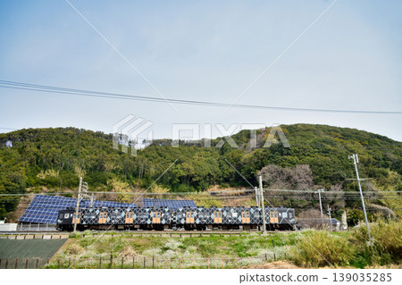 Auspicious train running near Isonoura Beach (Nankai Electric Railway, Kada Line) [Wakayama City, Wakayama Prefecture] 139035285