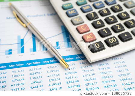 Calculator with pen on data business graphs paper. Calculator with pen on data business graphs paper. 139035722
