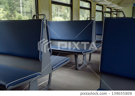 Empty passenger seats inside old railway carriage. 139035809