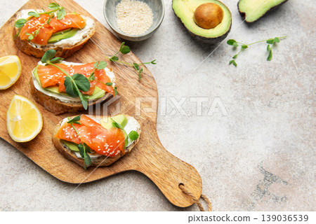 Smoked salmon toast with avocado and cream cheese Smoked salmon toast with avocado and cream cheese 139036539