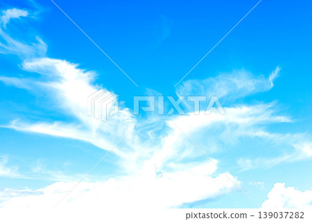A refreshing blue sky with clouds that look like birds soaring. A refreshing blue sky with clouds that look like birds soaring. 139037282