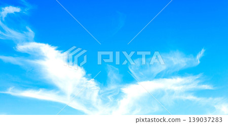 A refreshing blue sky with clouds that look like birds soaring. A refreshing blue sky with clouds that look like birds soaring. 139037283
