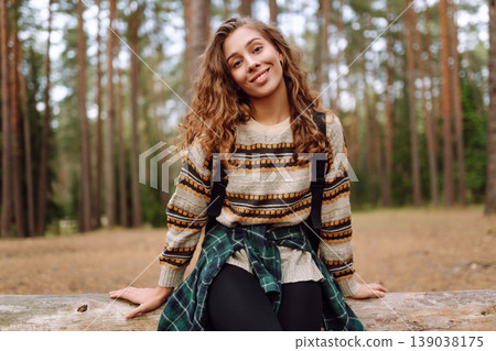 Tourist woman hiking alone in natural forest. Active lifestyle. People in forest. Nature, travel Tourist woman hiking alone in natural forest. Active lifestyle. People in forest. Nature, travel 139038175
