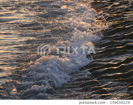 beautiful sea waves at sunset beautiful sea waves at sunset 139038229