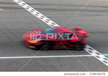 Motion blur, Race car racing on speed track, race car on road crossing start and finish line, Target business achieve and victory concept. 139038470