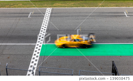 Motion blur, Race car racing on speed track, race car on road crossing start and finish line, Target business achieve and victory concept. . 139038475