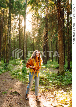 Stylish woman enjoying autumn weather in the park. Autumn mood. Hiking. Stylish woman enjoying autumn weather in the park. Autumn mood. Hiking. 139038514