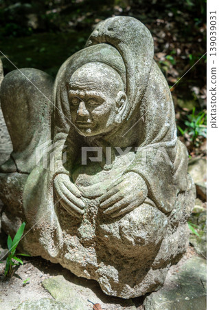 Stone monk statue at Mitaki-Dera temple in Hiroshima, Japan Stone monk statue at Mitaki-Dera temple in Hiroshima, Japan 139039031