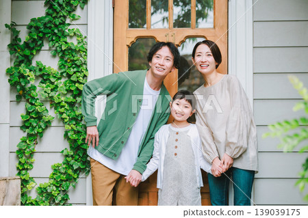 A close-knit family heading out with smiles on their faces. A close-knit family heading out with smiles on their faces. 139039175
