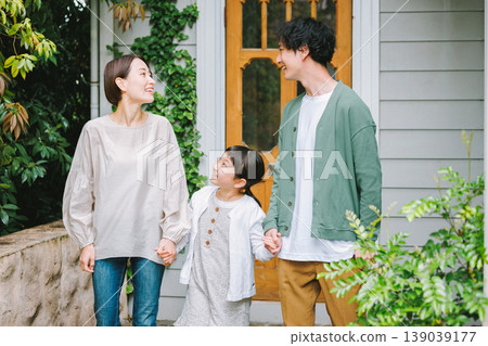 A close-knit family heading out with smiles on their faces. A close-knit family heading out with smiles on their faces. 139039177