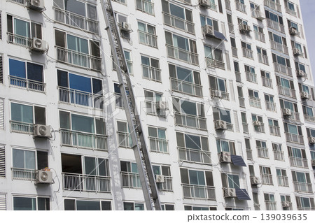 This is an apartment moving with a ladder truck. This is an apartment moving with a ladder truck. 139039635