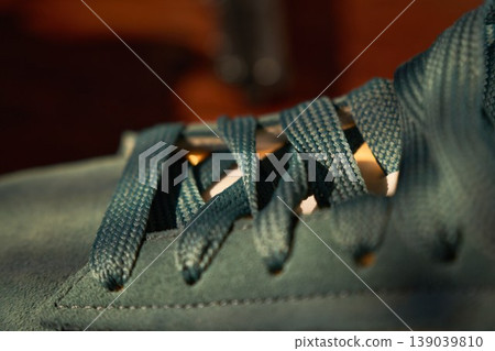 Fashionable sneaker image with lighting effects. Fashionforward athletic footwear shot emphasizing shadow and highlight play Fashionable sneaker image with lighting effects. Fashionforward athletic footwear shot emphasizing shadow and highlight play 139039810