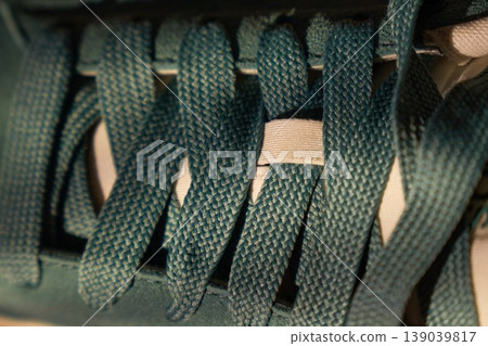 Detailed fabric closeup. Upclose photograph emphasizing detailed braided fibers and muted lighting effects on fabric 139039817