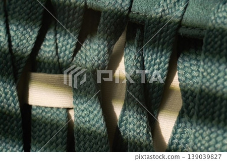 Indepth examination of fabric structure and design. Comprehensive study revealing textures in activewear fabric layers 139039827