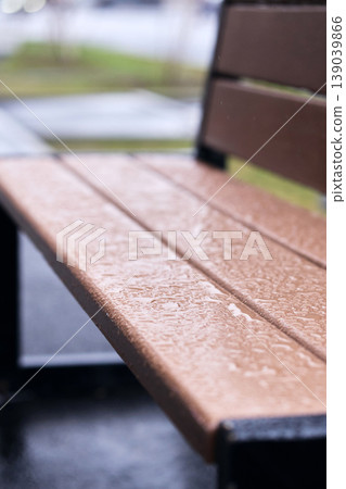 High-resolution macro of water surface tension and droplets on a textured synthetic wood material 139039866