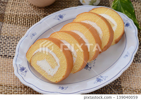 A delicious-looking roll cake on a plate A delicious-looking roll cake on a plate 139040059