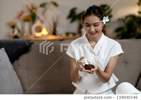 Asian adult woman prepare home spa beauty treatment product application self care relaxation wellness cozy living room environment 139040146