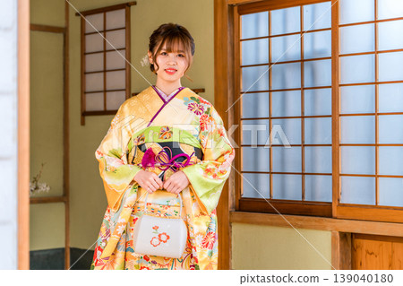 A young Japanese woman in a furisode kimono in a Japanese-style room (coming-of-age ceremony, 20th birthday celebration) A young Japanese woman in a furisode kimono in a Japanese-style room (coming-of-age ceremony, 20th birthday celebration) 139040180