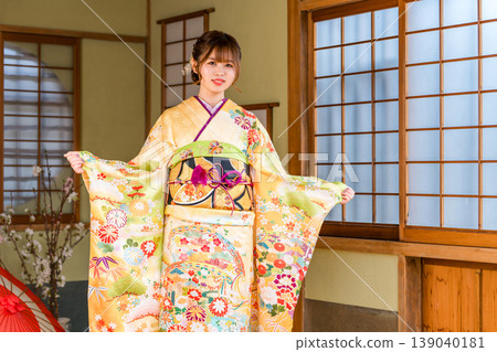 A young Japanese woman in a furisode kimono in a Japanese-style room (coming-of-age ceremony, 20th birthday celebration) A young Japanese woman in a furisode kimono in a Japanese-style room (coming-of-age ceremony, 20th birthday celebration) 139040181