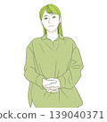 A woman with her hands clasped in front of her 139040371