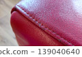 Red Leather Texture Close Up with Stitching 139040640