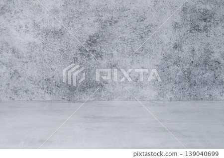 An empty concrete countertop against a gray textured wall. A minimalist style on a gray background. An empty concrete countertop against a gray textured wall. A minimalist style on a gray background. 139040699