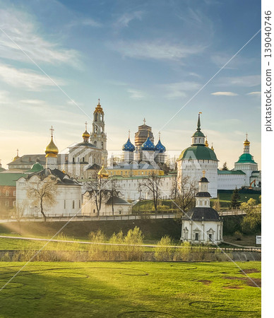 Orthodox monastery with golden domes at sunset, scenic historic architecture Orthodox monastery with golden domes at sunset, scenic historic architecture 139040746