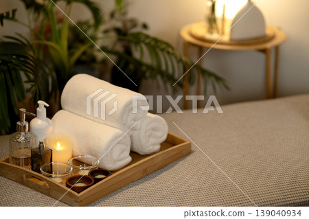 Spa wellness items essential relaxation warm candlelight soft towels oils serene home environment luxurious resort Spa wellness items essential relaxation warm candlelight soft towels oils serene home environment luxurious resort 139040934