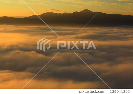 A mountain floating in the sea of clouds A mountain floating in the sea of clouds 139041293